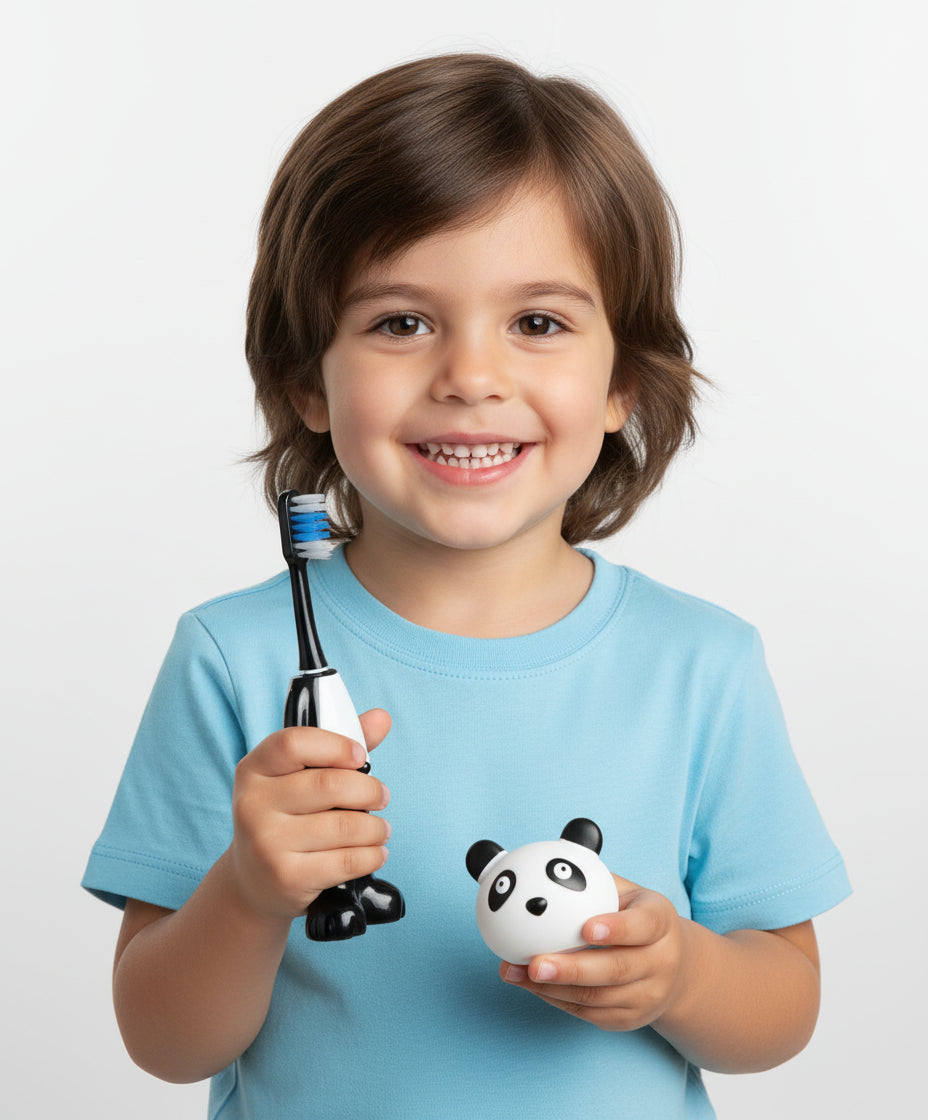 Penguin-shaped toothbrush and panda-shaped toothpaste container on a white background