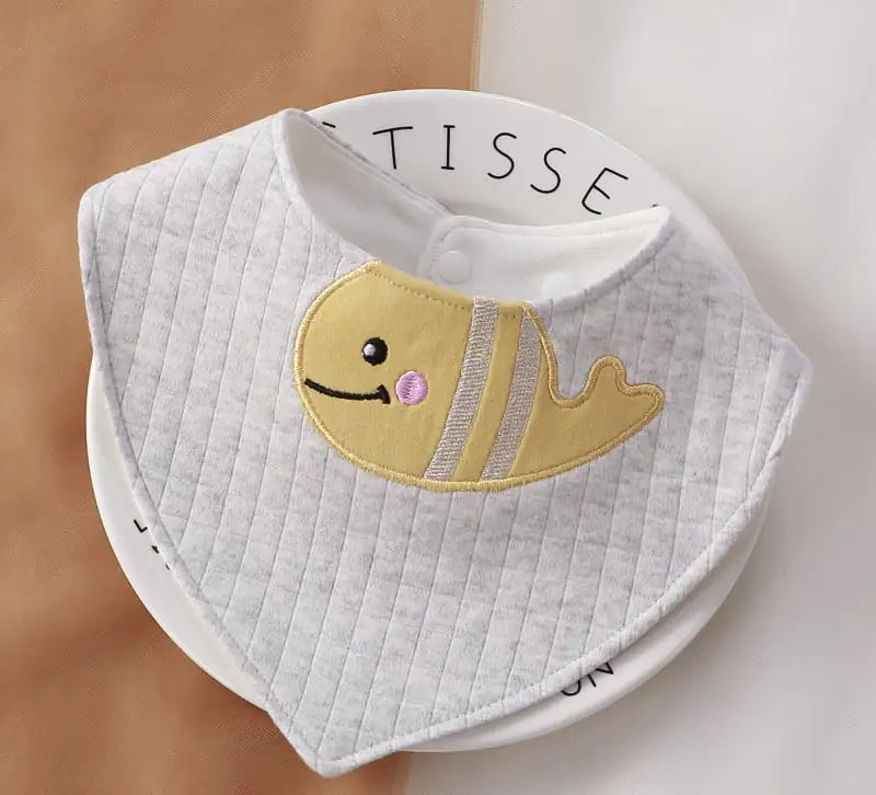Baby bib with fish design on a white background