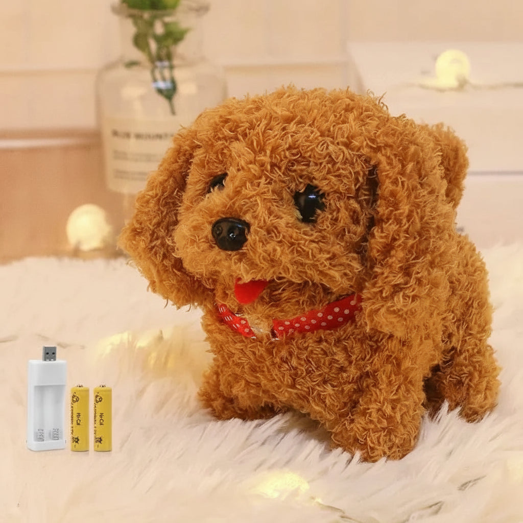 Brown toy dog with a red collar on a light surface, accompanied by a charger and batteries.