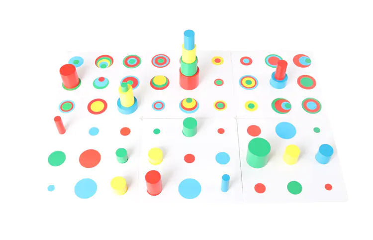 Colorful wooden cylindrical cards on a white background with text.