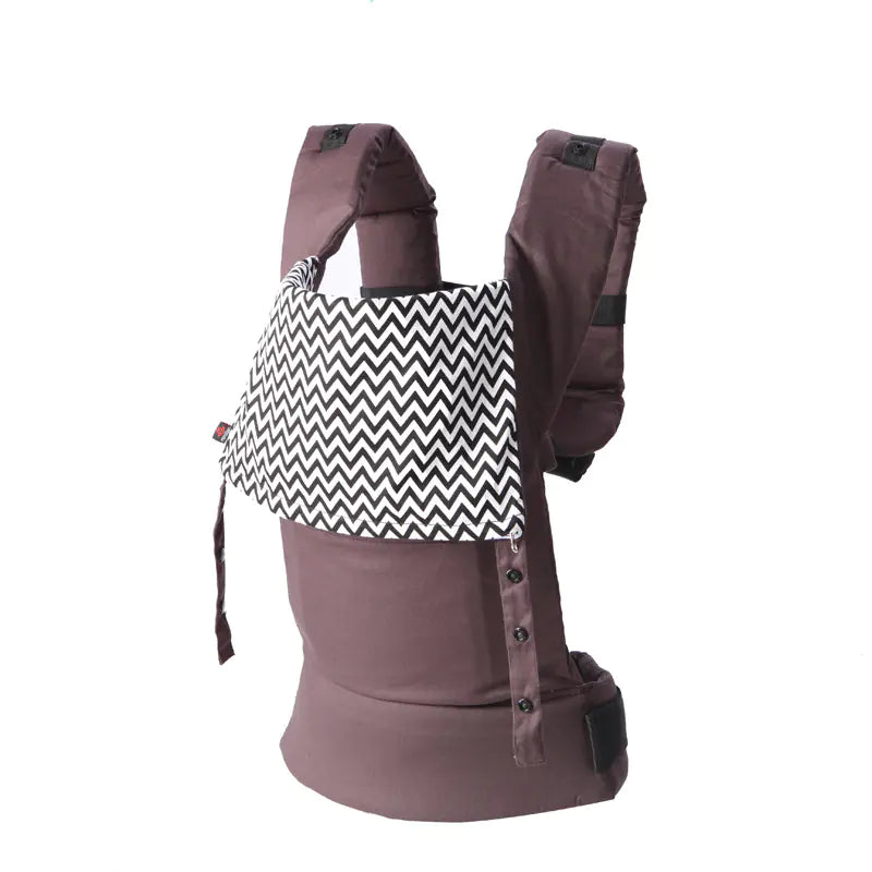 Brown baby carrier with a black and white zigzag pattern on a white background